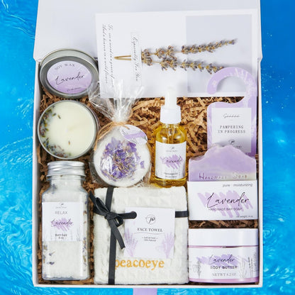 Flat lay of luxury lavender spa items including soap, scrub, and oil