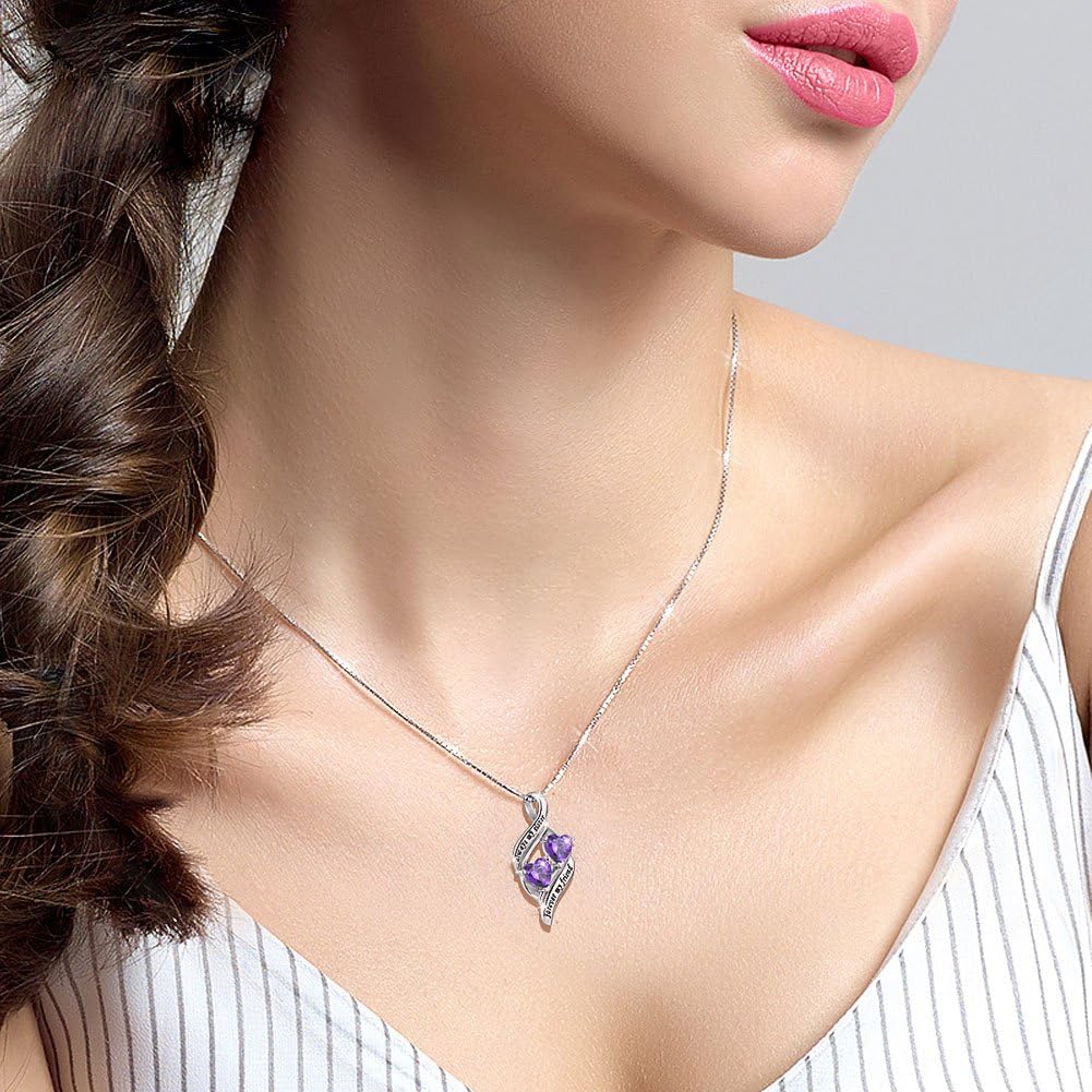 Close-up of woman wearing mother-daughter heart pendant necklace – loving family gift