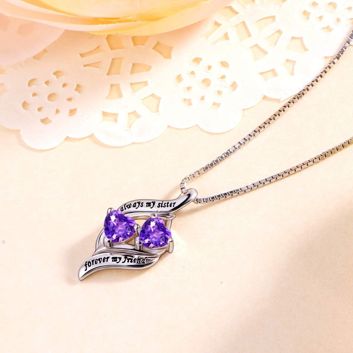 Twin heart crystal necklace representing mom and daughter love in purple tones