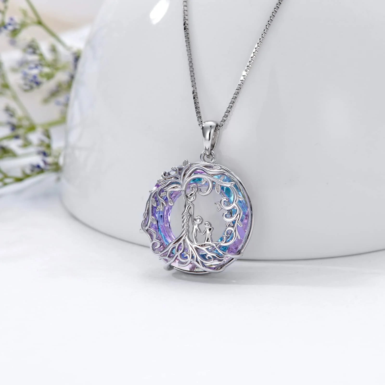 Close-up of pendant with purple crystals symbolizing family love